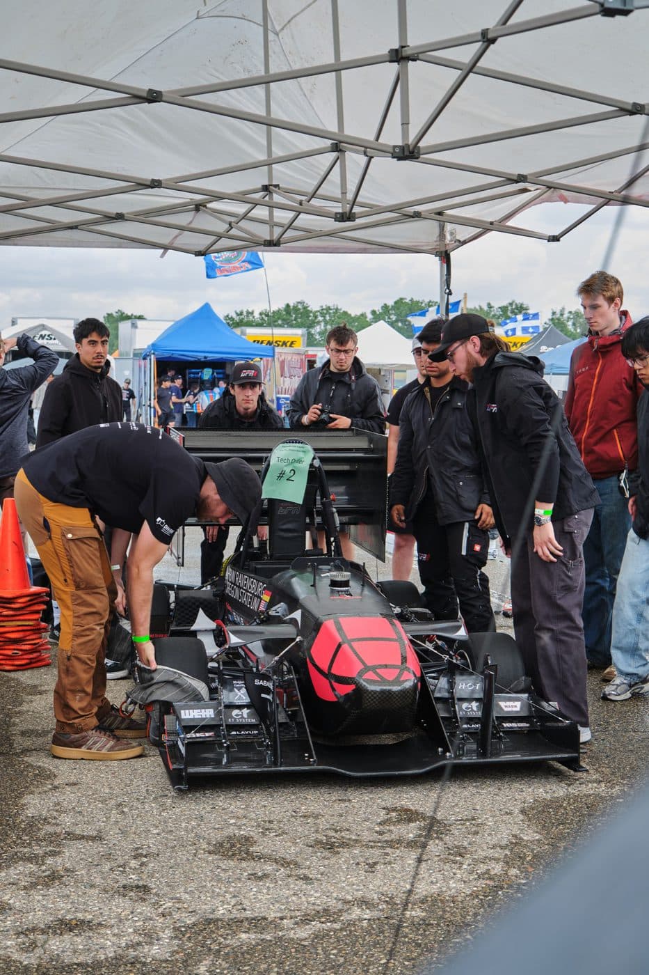 The car under the team tent during tech inspection at Formula SAE Michigan.