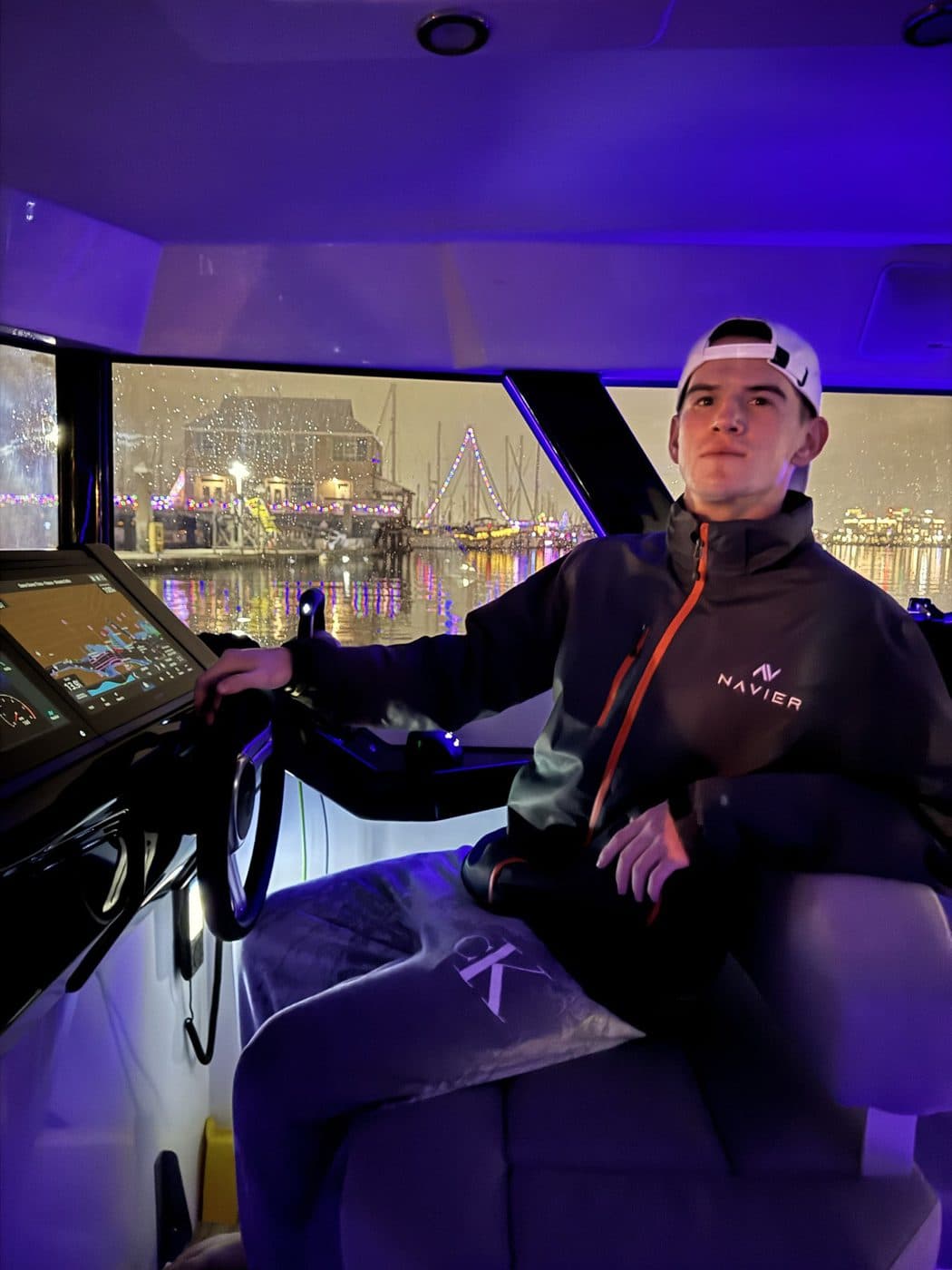 At the helm of the N30 during an evening test on the water.