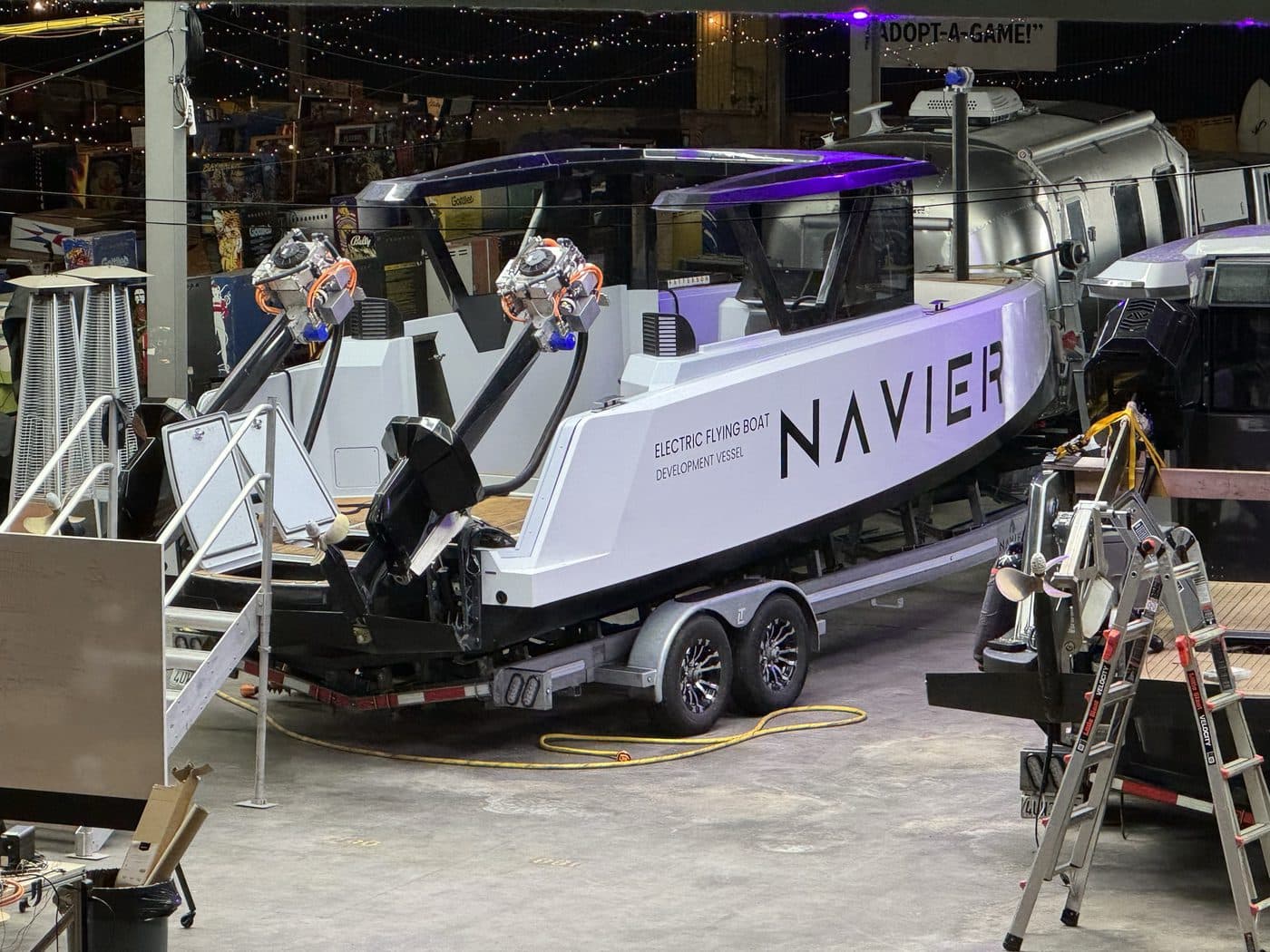 The development vessel on its trailer with both drive units raised.
