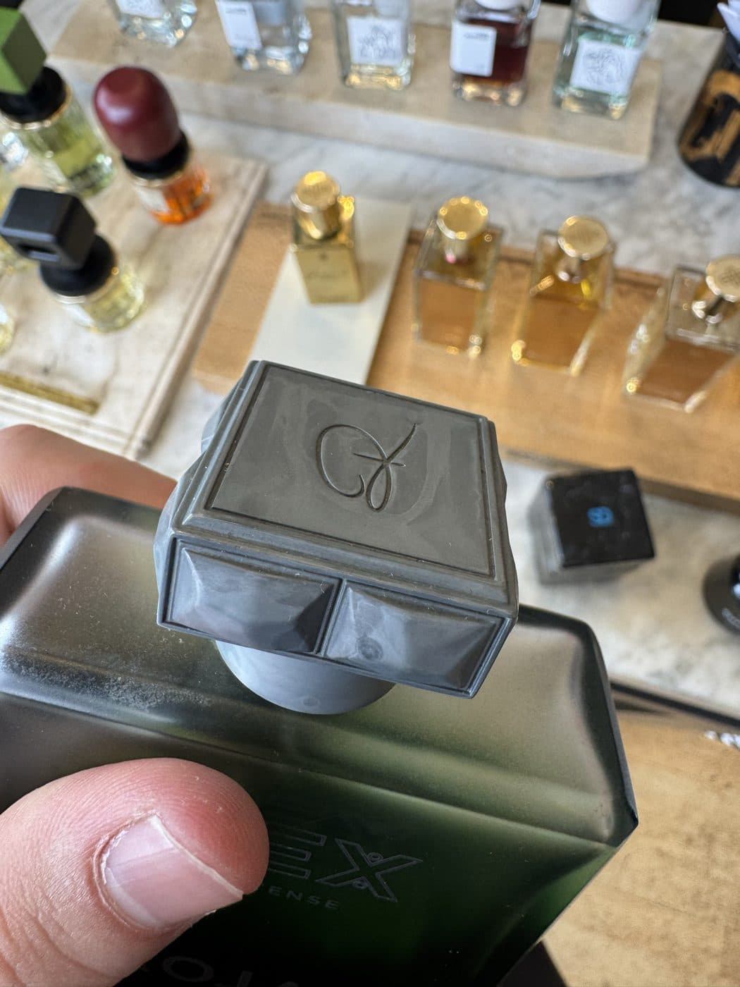 A printed cap trial-fitted to a production bottle to check the indexing.
