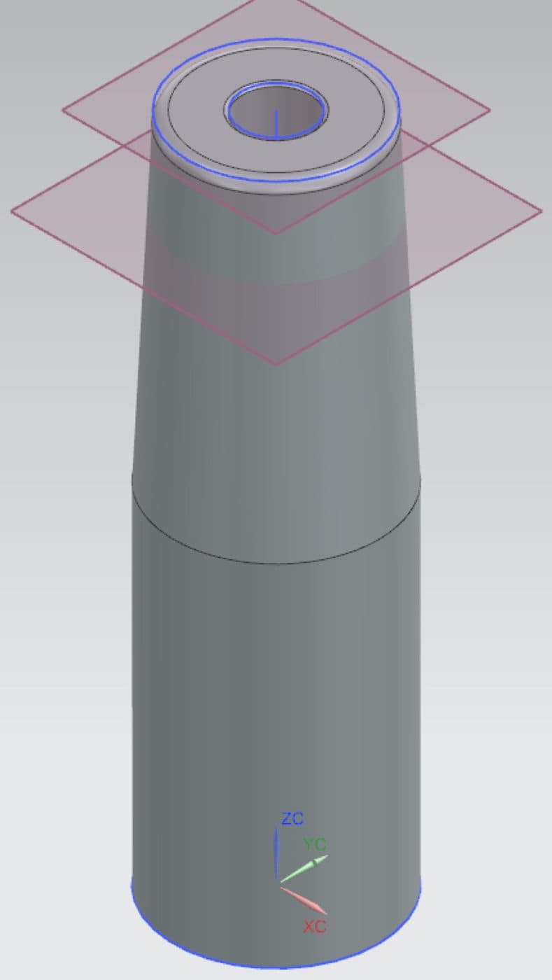 The tapered vial holder that the mechanism drives up through the body.