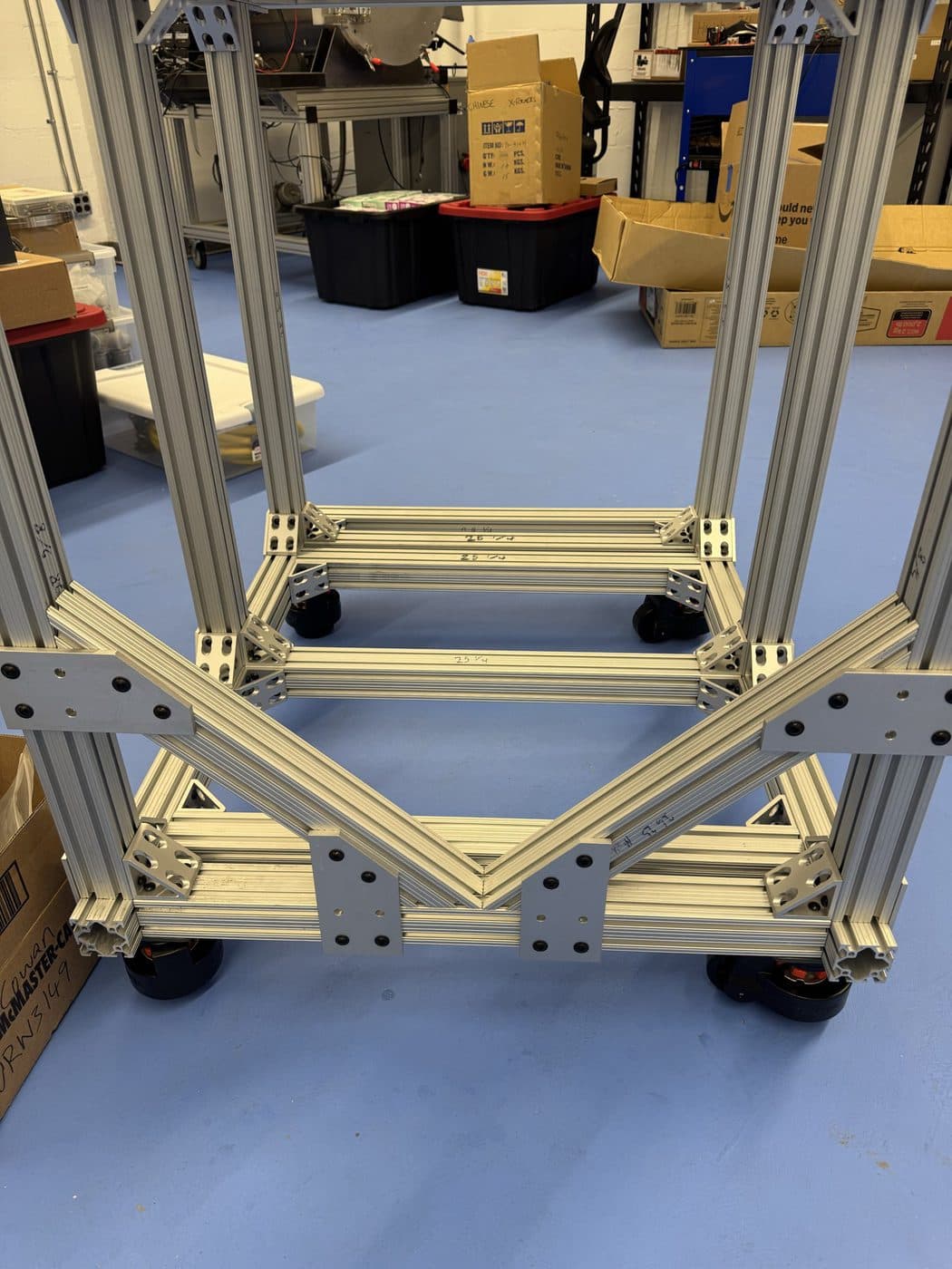 The same 80/20 frame with the gusset plates fitted and the corner brackets torqued down.